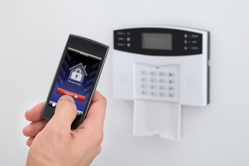 Security Alarm Keypad With Person Disarming The System