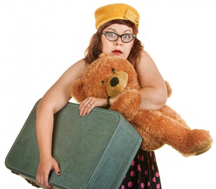 Stressed-woman-with-a-suitcase-and-teddy-Moving-abroad-with-kids-e1421275252444