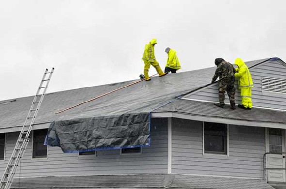 emergency_workers_on_roof-e1451342008493