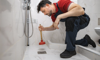 man plunging drain